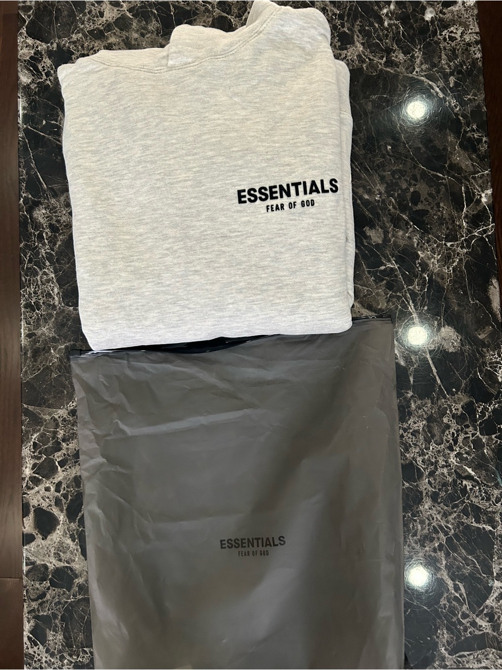ESSENTIALS Tee with Black Logo on White